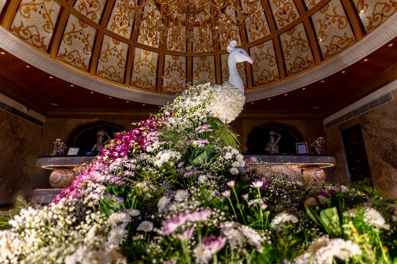 lovely realistic peacock decor made of flowers welcoming guests at the lobby