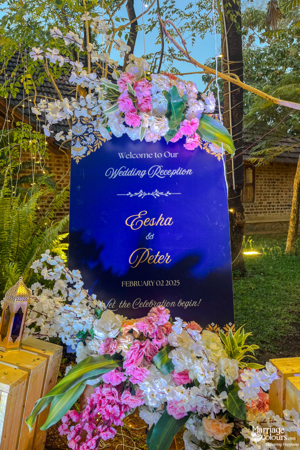 Wedding reception welcome sign for Eesha and Peter, dated February 02, 2025, surrounded by flowers.
