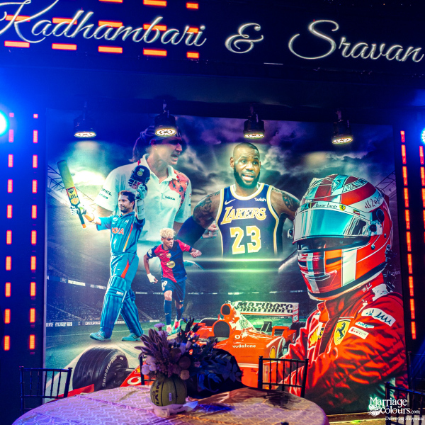 A large backlit banner of international sports stars, including Sachin Tendulkar and LeBron James, at a themed event.