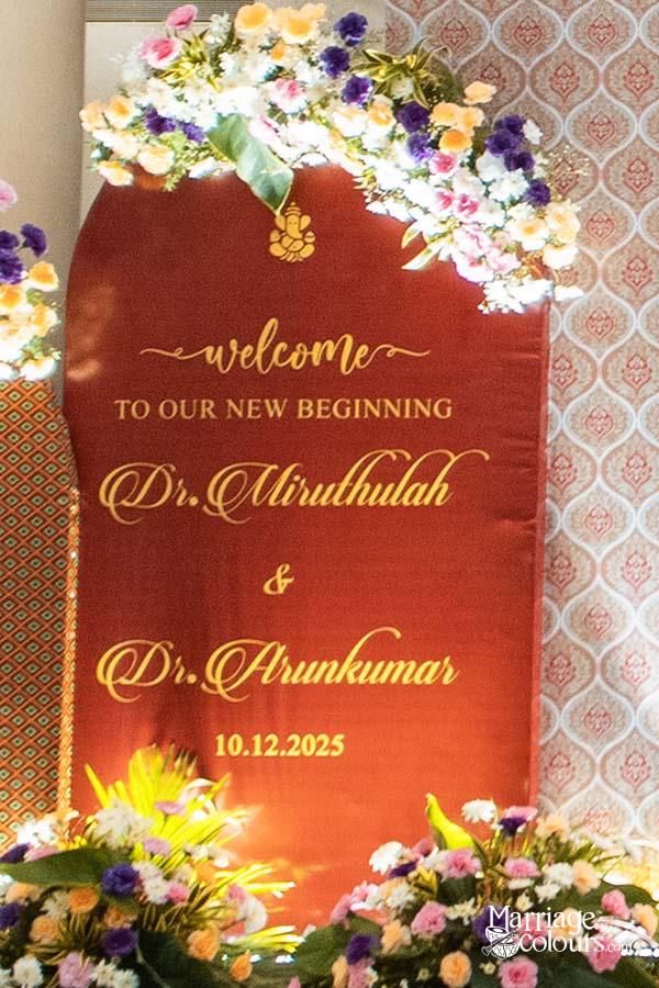 Personalized wedding welcome board with floral accents and gold ornate design