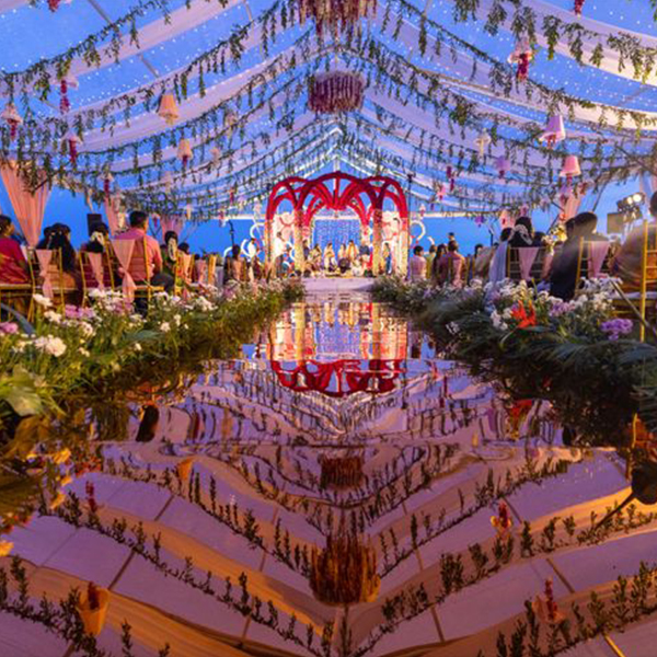Luxury destination beach wedding setup by Mariage Colours at one of the best beach resorts in Mahabalipuram, featuring an oceanfront lawn venue with premium floral decor.