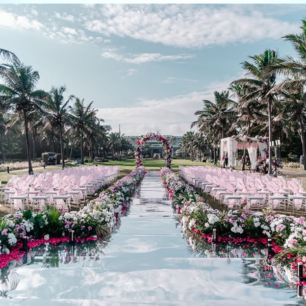 Luxury destination beach wedding setup by Mariage Colours at one of the best beach resorts in Mahabalipuram, featuring an oceanfront lawn venue with premium floral decor.